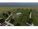 Aerial view of community amenities, including a pool, playground, and open green space at 199 Bull Frog Ln, Umatilla, FL 32784