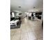Open concept living area with tile floors and kitchen view at 4738 Blue Diamond St, Kissimmee, FL 34746