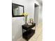 Entryway with a dark wood console table and mirror at 4738 Blue Diamond St, Kissimmee, FL 34746