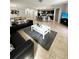 Bright and airy living room with open floor plan and large TV at 4738 Blue Diamond St, Kissimmee, FL 34746