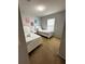 Bedroom with two twin beds, nightstands, and wall art at 4738 Blue Diamond St, Kissimmee, FL 34746