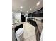 Modern kitchen featuring dark wood cabinets and granite countertops at 4738 Blue Diamond St, Kissimmee, FL 34746