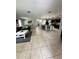 Open concept living area with tile floors and kitchen view at 4738 Blue Diamond St, Kissimmee, FL 34746