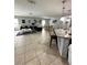 Open-concept living area with kitchen and dining space at 4738 Blue Diamond St, Kissimmee, FL 34746