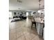 Open-concept living area with kitchen and dining space at 4738 Blue Diamond St, Kissimmee, FL 34746