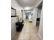 Bright hallway with tile flooring and access to other rooms at 4738 Blue Diamond St, Kissimmee, FL 34746