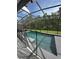 Inviting swimming pool with safety fence and lush landscaping at 4738 Blue Diamond St, Kissimmee, FL 34746