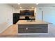 Modern kitchen featuring dark wood cabinets and granite countertops at 3073 Royal Tern Dr, Winter Haven, FL 33881