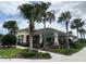 Community clubhouse with pool and covered patio area at 3073 Royal Tern Dr, Winter Haven, FL 33881