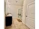 Bathroom with double vanity, granite countertop, and large shower at 3073 Royal Tern Dr, Winter Haven, FL 33881