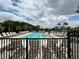 Large community pool with plenty of lounge chairs at 3073 Royal Tern Dr, Winter Haven, FL 33881