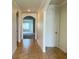 Bright hallway with tile flooring and arched doorways at 3073 Royal Tern Dr, Winter Haven, FL 33881