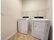 Laundry room with washer and dryer, and overhead shelving at 3073 Royal Tern Dr, Winter Haven, FL 33881