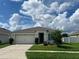 Exterior view of a single story home with a two-car garage at 3073 Royal Tern Dr, Winter Haven, FL 33881