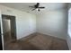 Bedroom with carpet, ceiling fan, and access to another bedroom and bathroom at 3073 Royal Tern Dr, Winter Haven, FL 33881