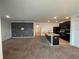 Open kitchen with island, granite countertops, and stainless steel appliances at 3073 Royal Tern Dr, Winter Haven, FL 33881