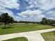 Open green space with a soccer field and walking path at 3073 Royal Tern Dr, Winter Haven, FL 33881