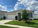 Exterior view of a single story home with a two-car garage at 3073 Royal Tern Dr, Winter Haven, FL 33881