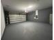 Garage with automatic garage door opener and painted floor at 3073 Royal Tern Dr, Winter Haven, FL 33881