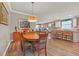 Charming dining room with wood table and comfortable seating for six at 356 Toldedo Rd, Davenport, FL 33837