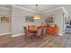 Bright dining area with wood table and chairs, ideal for Gathering meals at 356 Toldedo Rd, Davenport, FL 33837