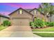 Beautiful two-story house with a large driveway and landscaped yard at 356 Toldedo Rd, Davenport, FL 33837