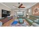 Relaxing living room with comfortable sofas, a large TV, and ceiling fan at 356 Toldedo Rd, Davenport, FL 33837
