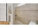 Large walk-in shower with neutral tile and built-in seat at 356 Toldedo Rd, Davenport, FL 33837