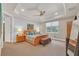 Spacious bedroom with a king-size bed, carpet, and plenty of natural light at 356 Toldedo Rd, Davenport, FL 33837