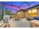 Relaxing covered patio with seating area and grill at 356 Toldedo Rd, Davenport, FL 33837
