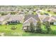 Backyard view showing homes with lanais and lush landscaping at 356 Toldedo Rd, Davenport, FL 33837