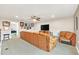 Spacious media room featuring a large sectional sofa and flat-screen TV at 356 Toldedo Rd, Davenport, FL 33837