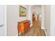 Bright entryway with hardwood floors and antique dresser at 356 Toldedo Rd, Davenport, FL 33837