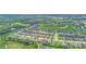 Aerial view of a community with numerous houses and green spaces at 356 Toldedo Rd, Davenport, FL 33837