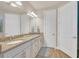 Elegant bathroom with double sinks, granite countertop, and neutral decor at 356 Toldedo Rd, Davenport, FL 33837