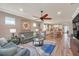 Open living room with comfortable seating and views into the kitchen at 356 Toldedo Rd, Davenport, FL 33837