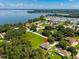 Aerial view of house near lake and residential area at 319 Water Shore Dr, Leesburg, FL 34748