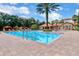 Inviting community pool with surrounding lounge area and brick pavers at 1301 Tuscan Ter # 9403, Davenport, FL 33896