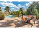 Inviting pool area with comfortable lounge chairs and patio tables at 1301 Tuscan Ter # 9403, Davenport, FL 33896