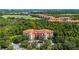 Aerial view of condo building showcasing surrounding landscape at 1301 Tuscan Ter # 9403, Davenport, FL 33896