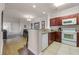 Open kitchen features granite countertops, stainless steel appliances, and a breakfast bar at 1301 Tuscan Ter # 9403, Davenport, FL 33896