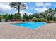 Resort-style pool with ample lounge chairs and shaded cabanas at 1301 Tuscan Ter # 9403, Davenport, FL 33896