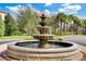 Elegant community fountain with tiered basins and lush landscaping at 1301 Tuscan Ter # 9403, Davenport, FL 33896