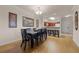 Bright dining room with hardwood floors and kitchen views at 1301 Tuscan Ter # 9403, Davenport, FL 33896