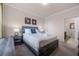 Bedroom with a bed, nightstands, and en-suite bathroom at 1301 Tuscan Ter # 9403, Davenport, FL 33896