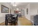 Dining room with six chairs and hardwood flooring at 1301 Tuscan Ter # 9403, Davenport, FL 33896