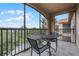 Screened balcony with table and chairs at 1301 Tuscan Ter # 9403, Davenport, FL 33896