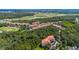 Aerial view of community highlighting its location near golf course and highway at 1301 Tuscan Ter # 9403, Davenport, FL 33896