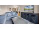 Living area with gray sofa, coffee table, and a large flat-screen TV at 1301 Tuscan Ter # 9403, Davenport, FL 33896
