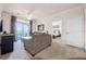 Spacious living room with comfortable seating, large windows, and access to a balcony at 1301 Tuscan Ter # 9403, Davenport, FL 33896